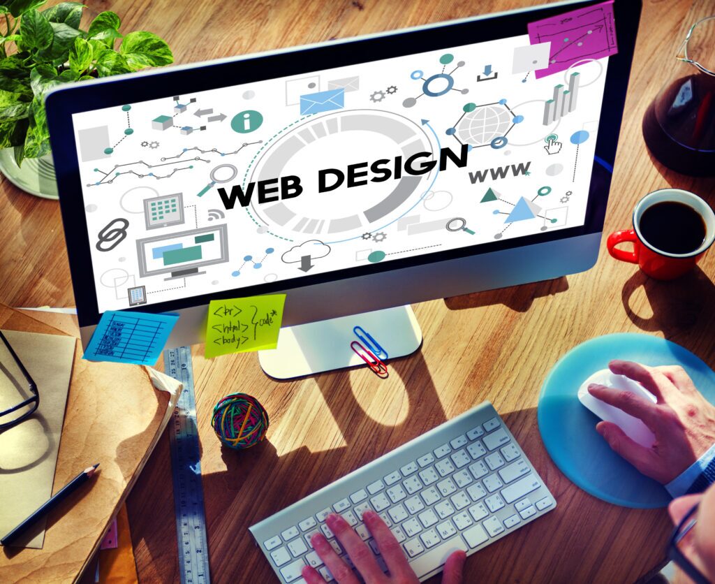 Developers working on modern web interfaces in a tech office, representing a leading Website Development Company in Bangalore